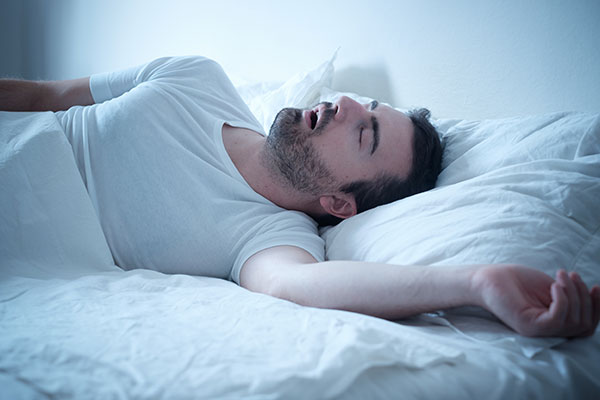 man sleeping with his mouth open